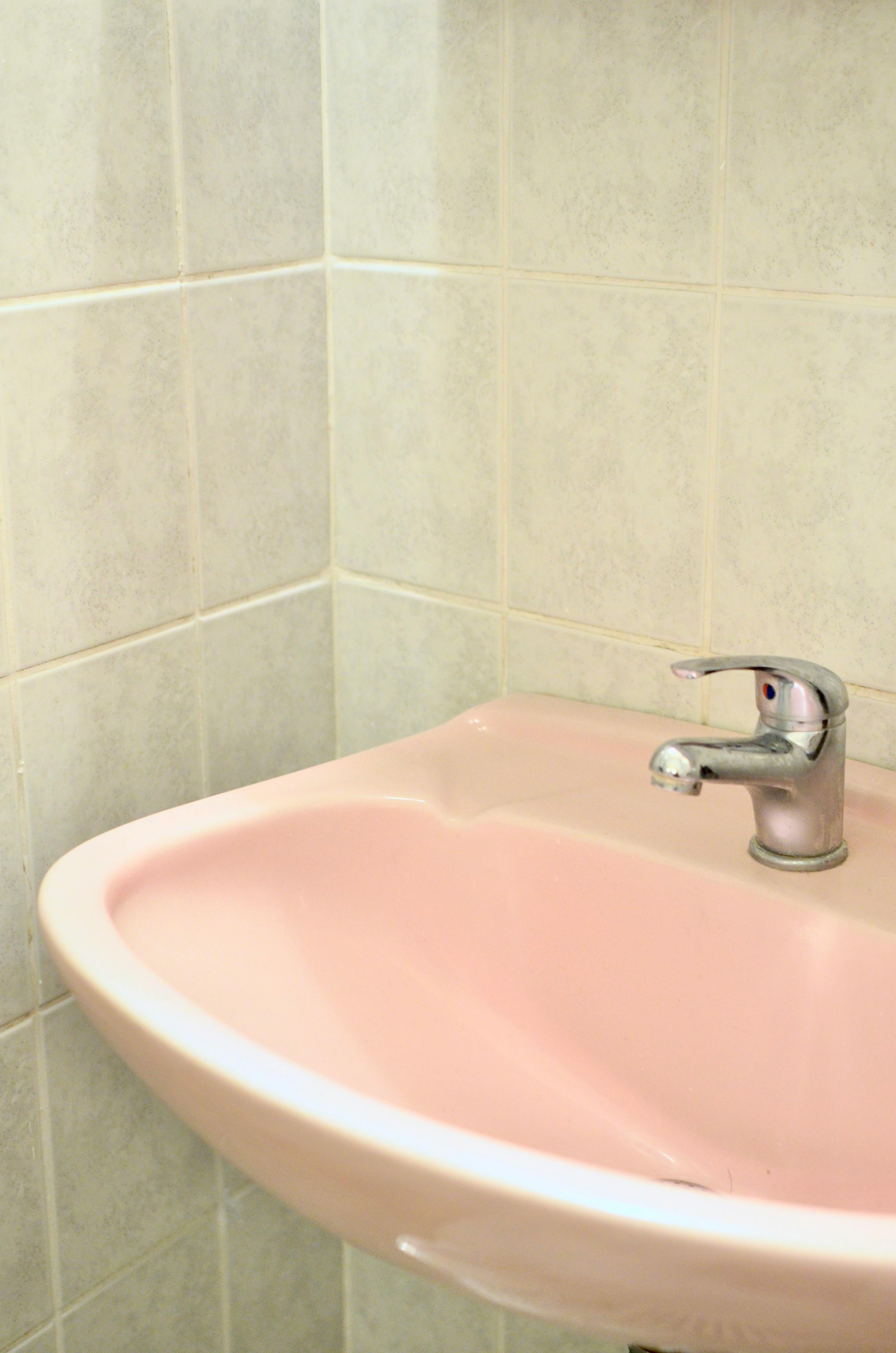 Using tools to unclog a bathroom sink